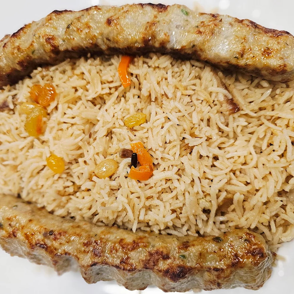 Juicy grilled kebabs served with flavorful rice platter