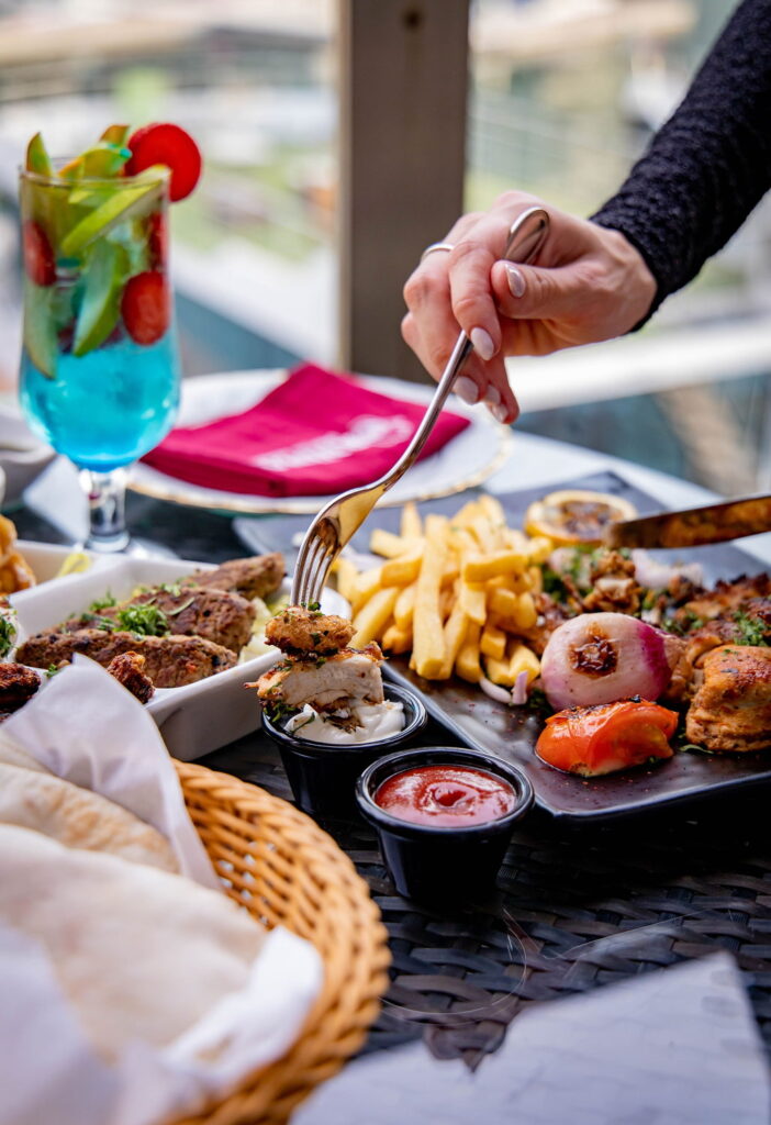 Mixed grill platter served with fries and refreshing drink