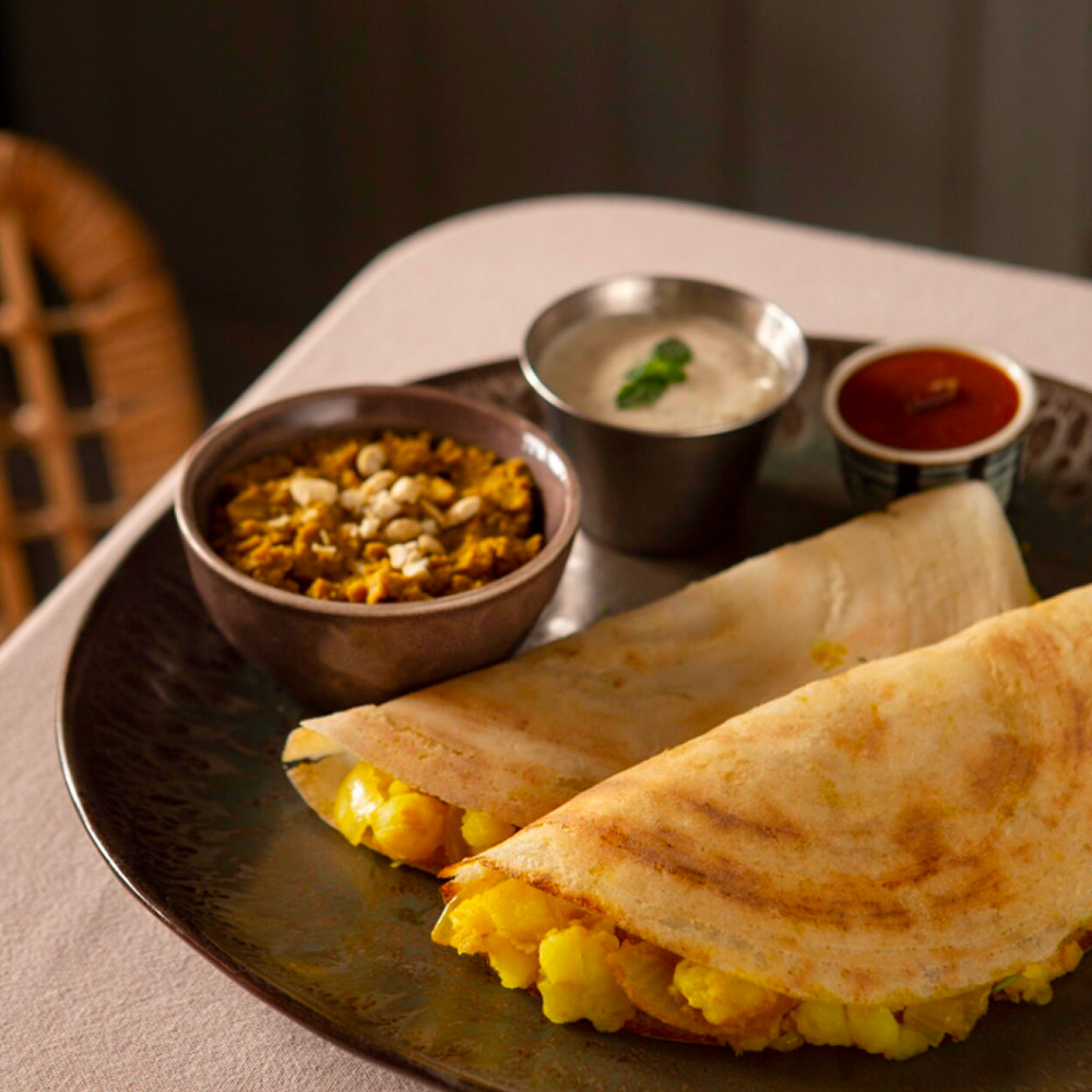 Crispy masala dosa served with chutney and sambar
