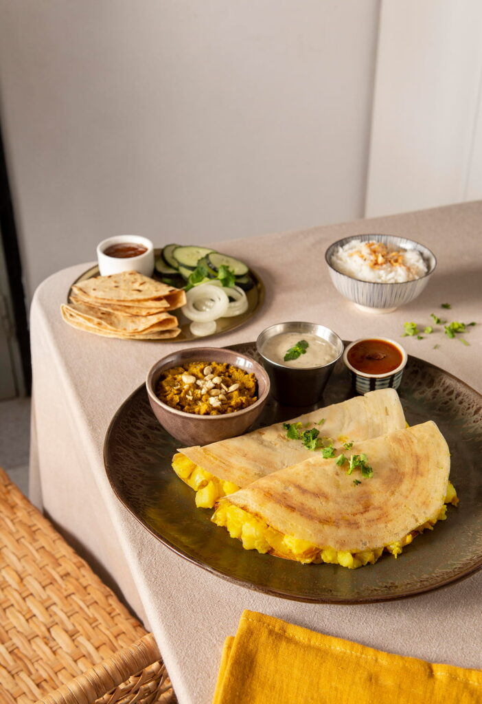 Crispy masala dosa served with chutneys and coconut dip