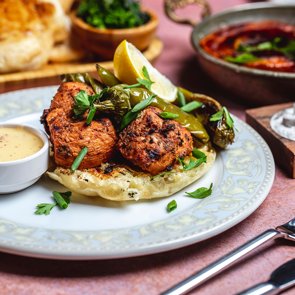 Spicy grilled chicken served with chutney and fresh herbs