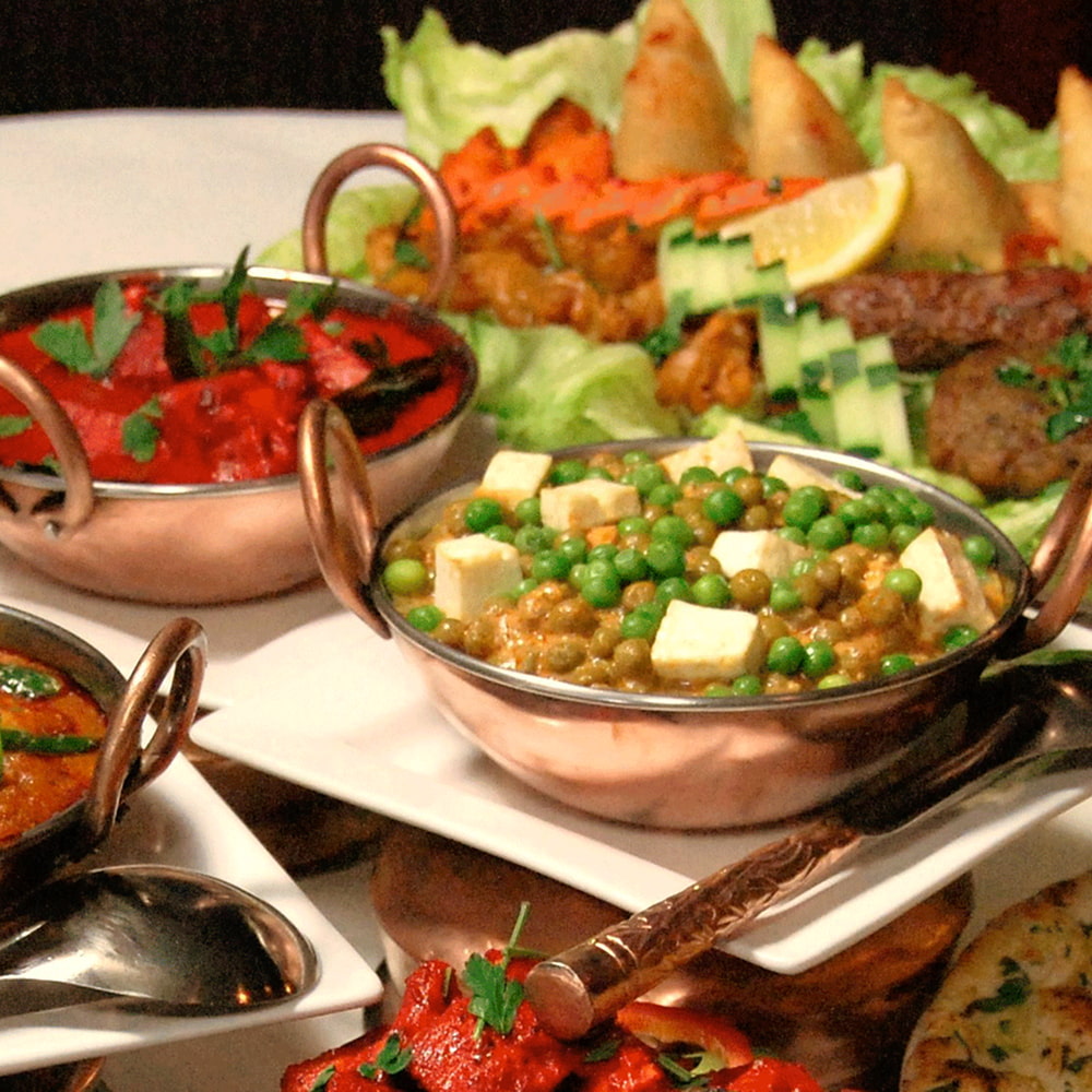Traditional Pakistani dishes served with appetizers and fresh salad
