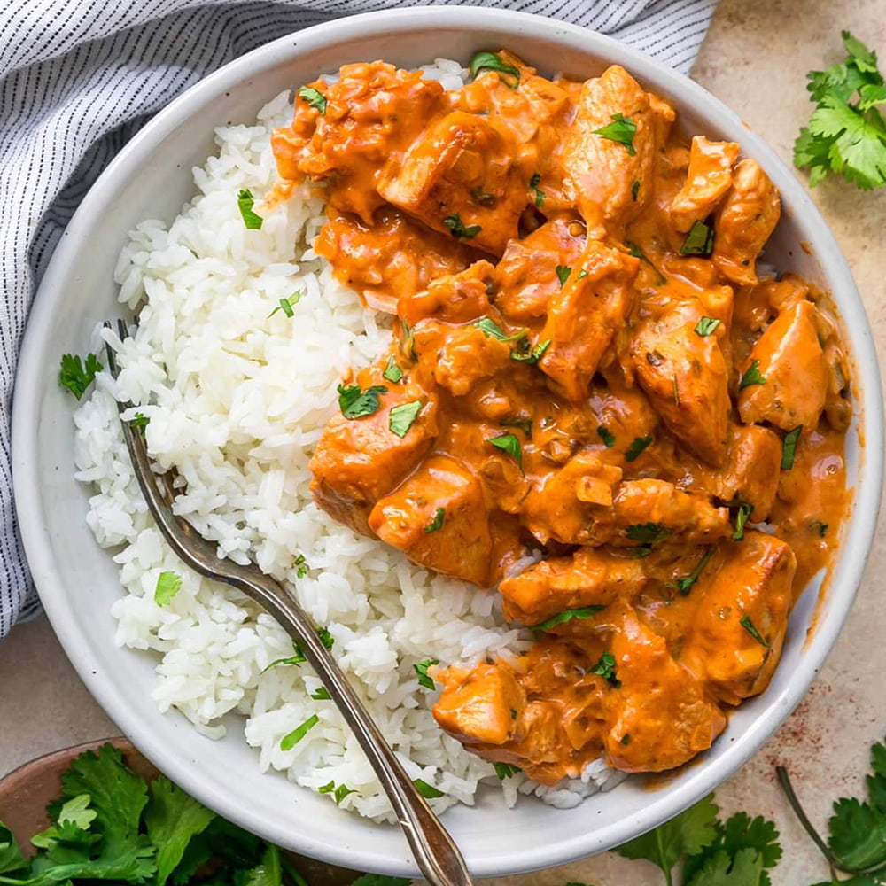 Creamy butter chicken served with fluffy white basmati rice