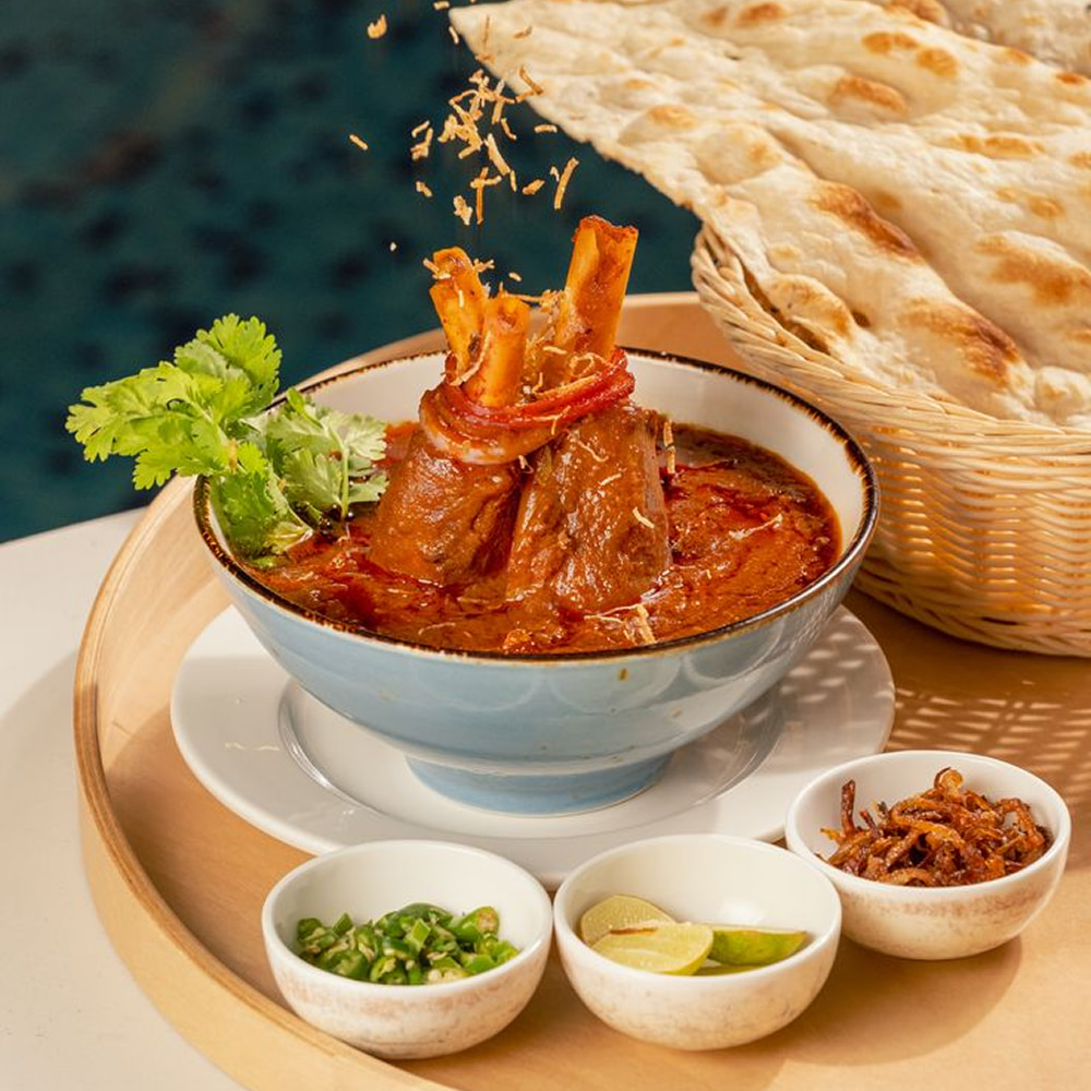 Slow cooked lamb curry served with fresh naan bread