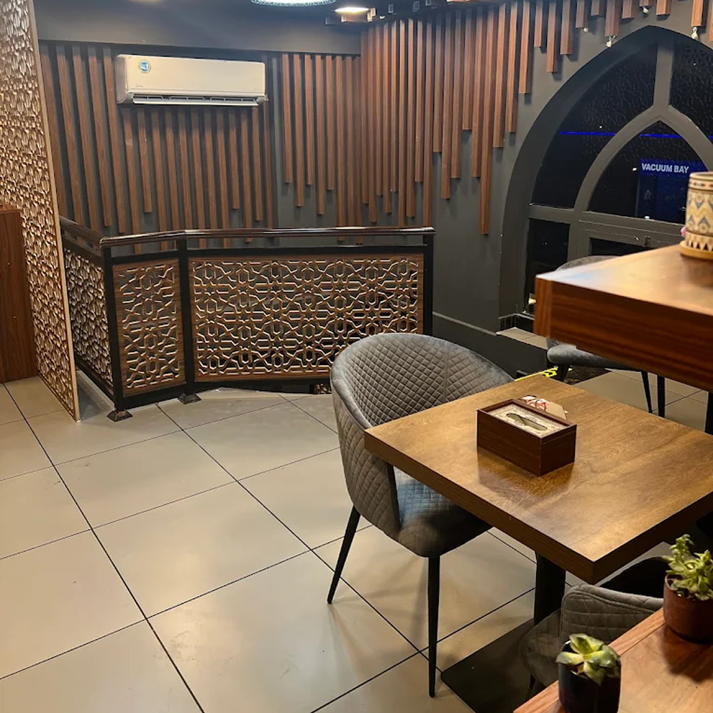 Modern restaurant interior with wooden decor and cozy seating