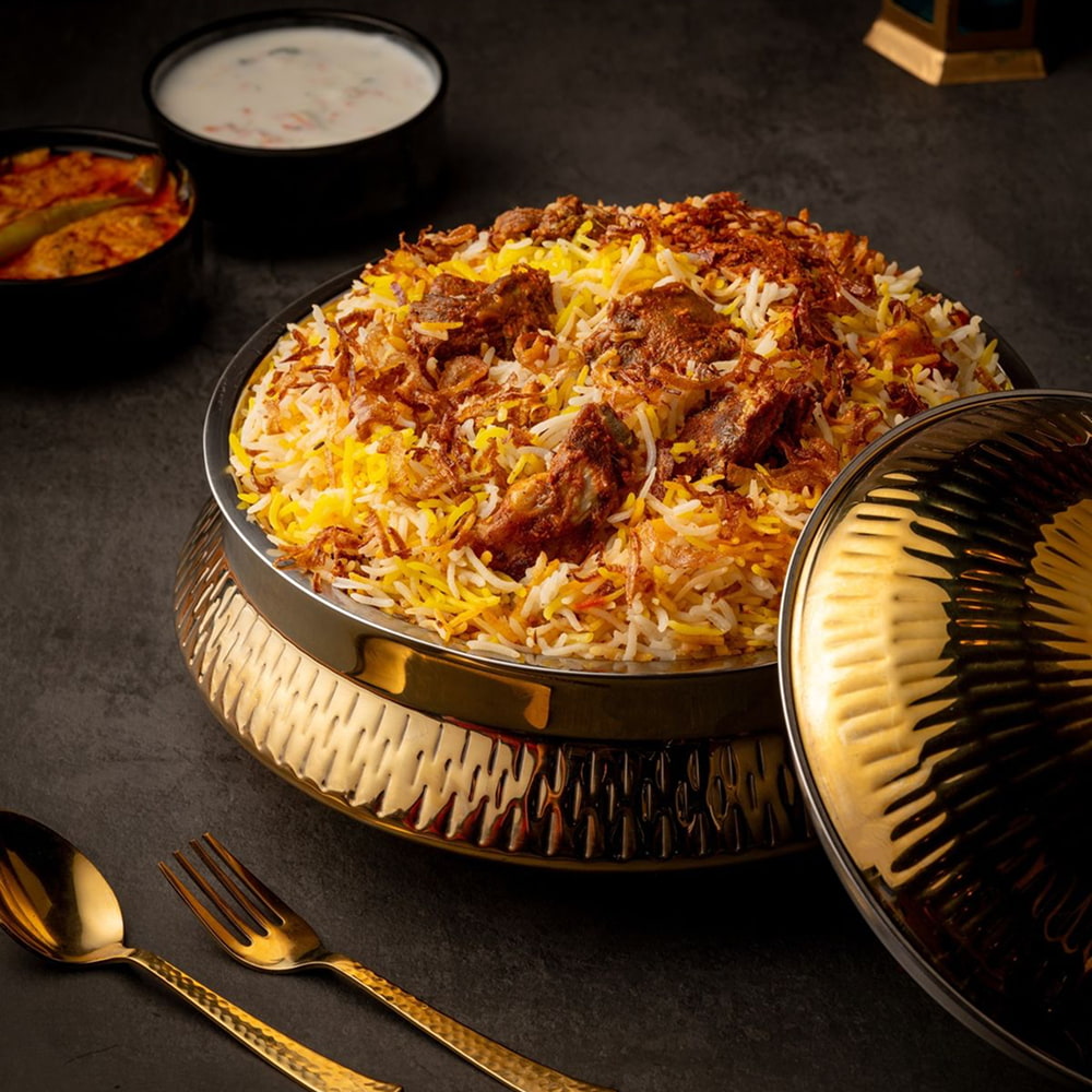 Fragrant biryani rice served in a traditional platter with spices