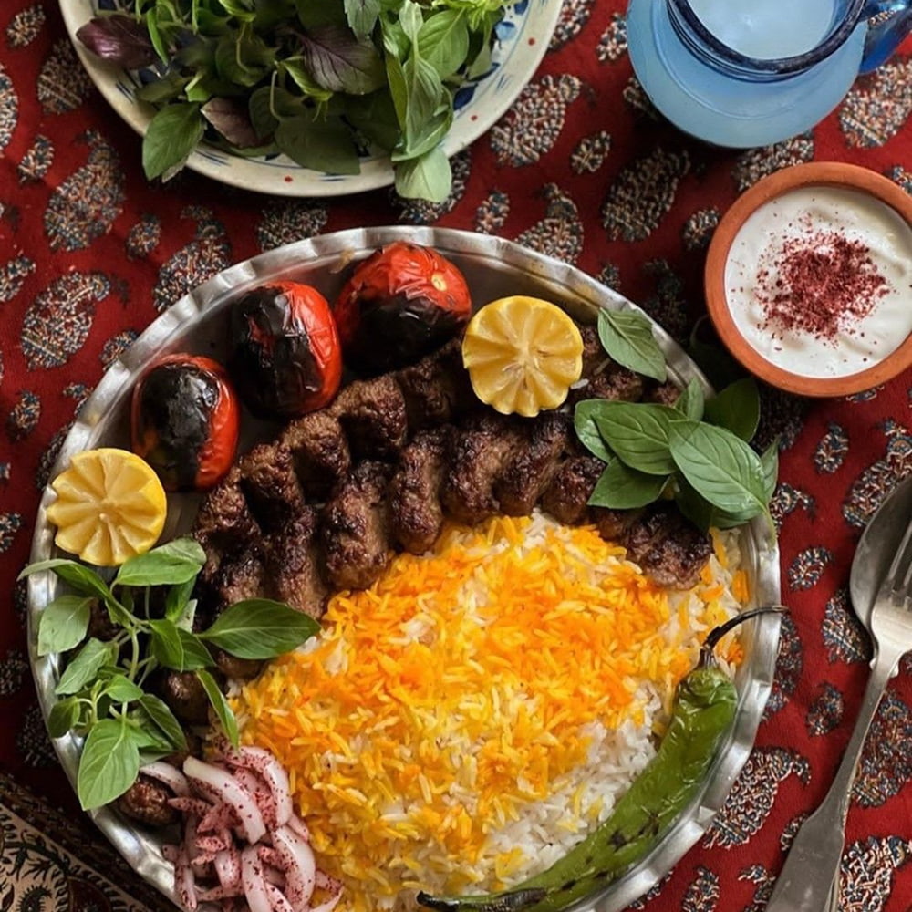 Traditional Iranian kebab platter served with saffron rice