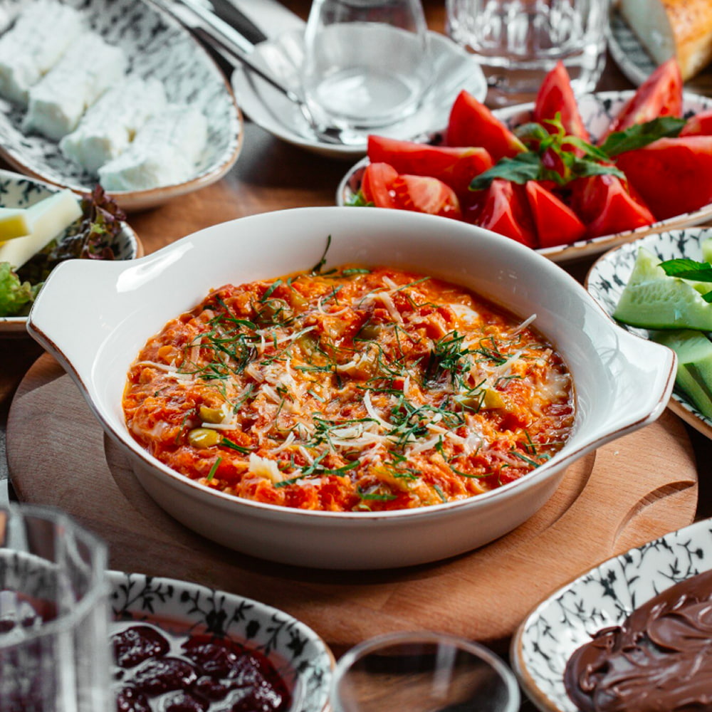 Traditional Iranian egg dish served with fresh herbs